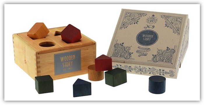 Prodktfoto der hochwertigen Sortierbox von Wooden Story mit unterschiedlichen Formen und der Verpackung